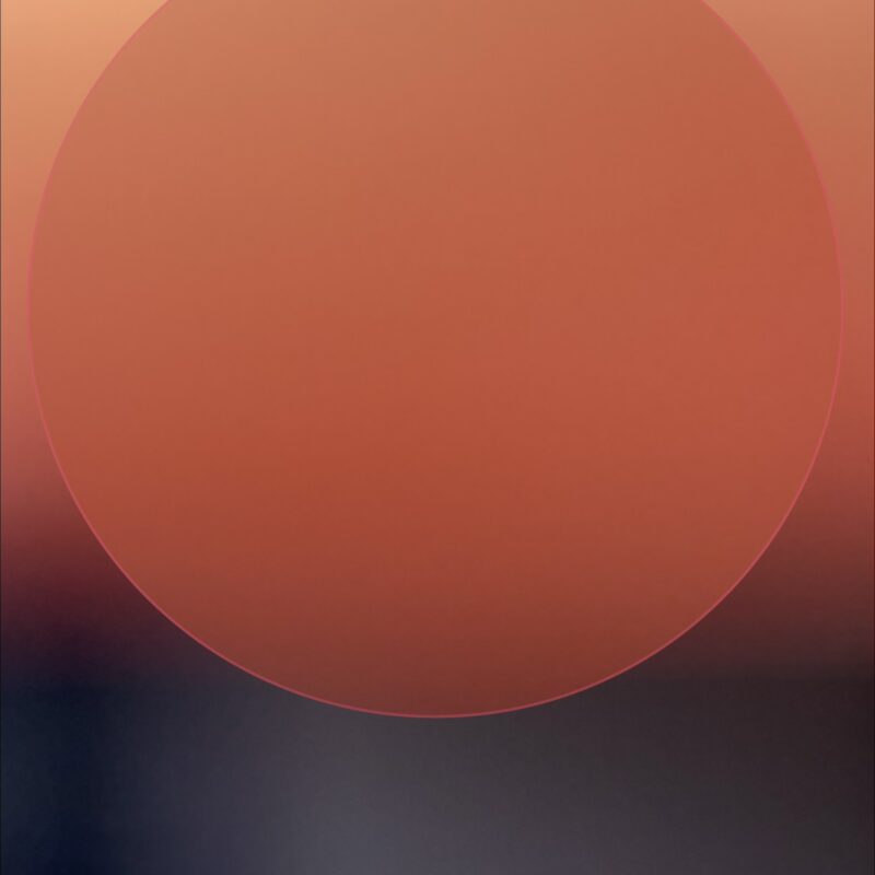 abstract art looks like large orange sun over blurry background by Elizabeth